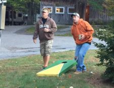 two men playing corn hole