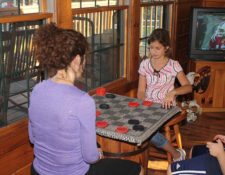 two girls playing checkers